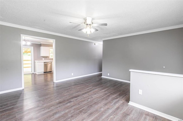 spare room with dark hardwood / wood-style flooring, crown molding, a textured ceiling, and ceiling fan