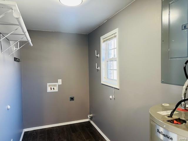 clothes washing area with dark wood-type flooring, electric panel, hookup for a washing machine, hookup for an electric dryer, and water heater