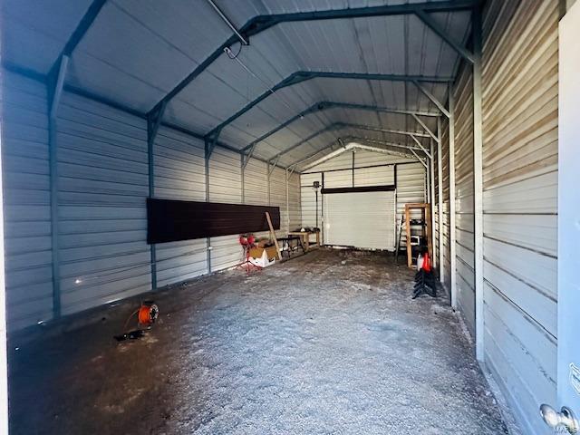 garage featuring a carport