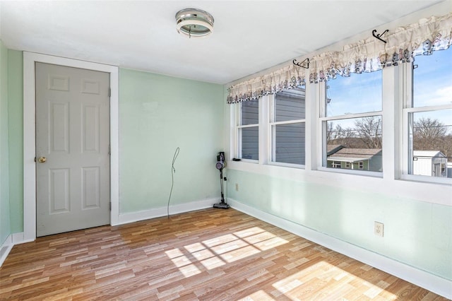 spare room featuring light wood-type flooring