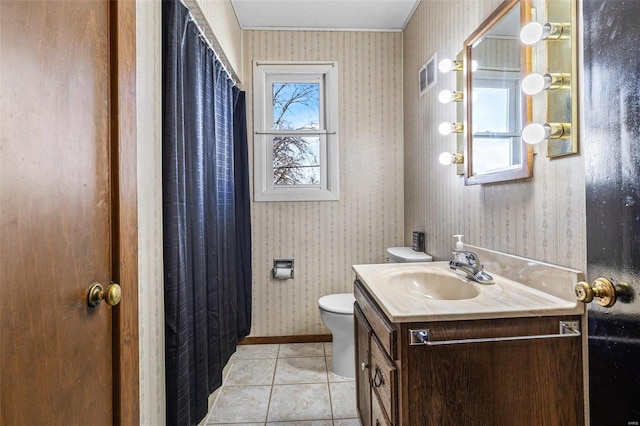 bathroom with vanity, tile patterned flooring, and toilet