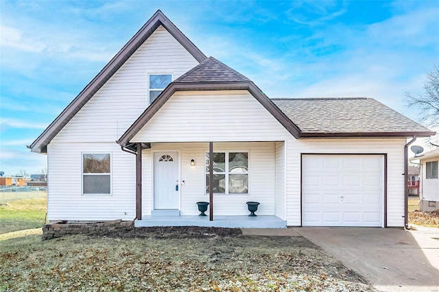 view of front of house with a garage and a porch