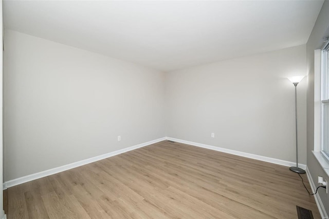 unfurnished room featuring light hardwood / wood-style flooring