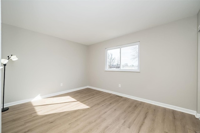 empty room with light hardwood / wood-style floors