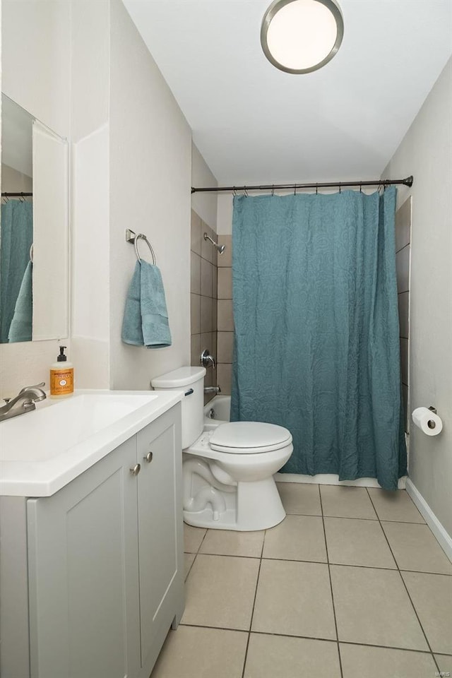 full bathroom with vanity, tile patterned flooring, toilet, and shower / bath combo with shower curtain