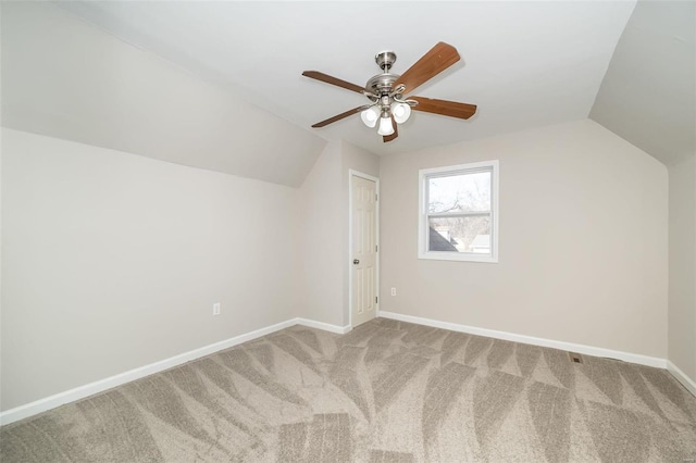 additional living space with vaulted ceiling, ceiling fan, and carpet flooring