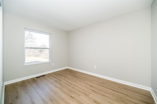 spare room featuring light hardwood / wood-style floors