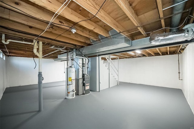 basement featuring heating unit and gas water heater