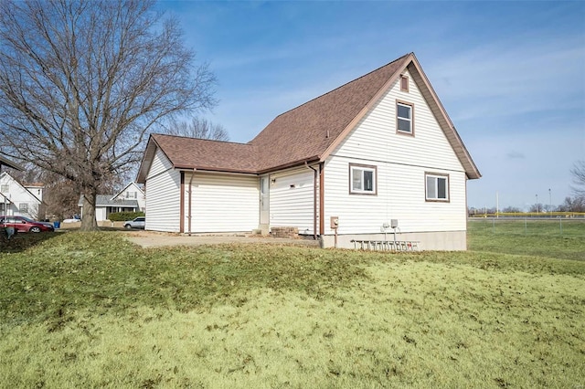 view of property exterior with a lawn