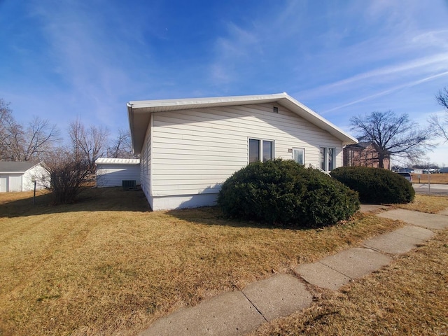 view of home's exterior with a yard