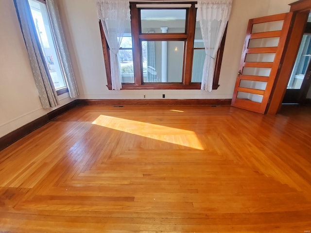 empty room with light parquet flooring