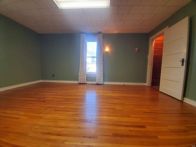 spare room featuring light hardwood / wood-style floors