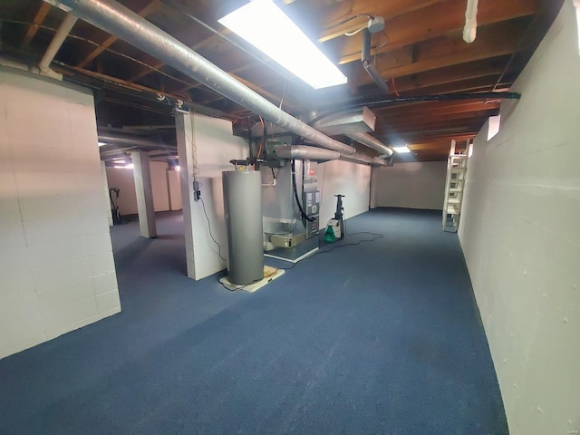 basement featuring gas water heater and heating unit