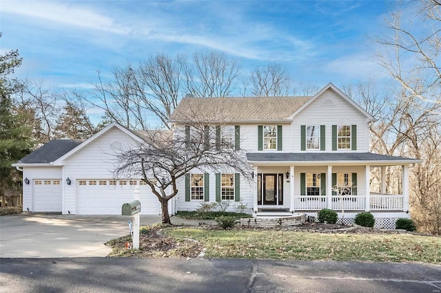 view of front of home featuring a porch, an attached garage, and concrete driveway