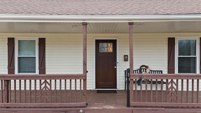 property entrance with covered porch