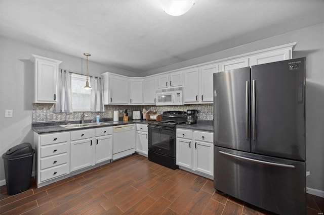 kitchen featuring sink, white cabinets, white appliances, and decorative light fixtures