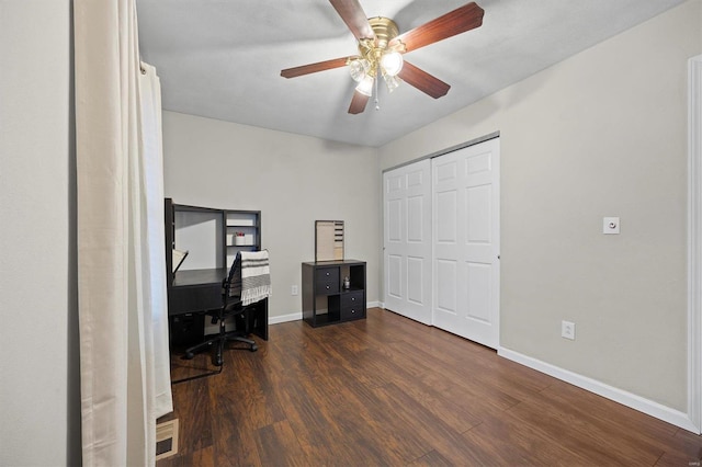 office with dark hardwood / wood-style flooring and ceiling fan