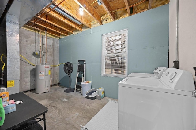 washroom featuring washing machine and clothes dryer and water heater