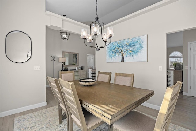 dining room with a notable chandelier and light hardwood / wood-style floors