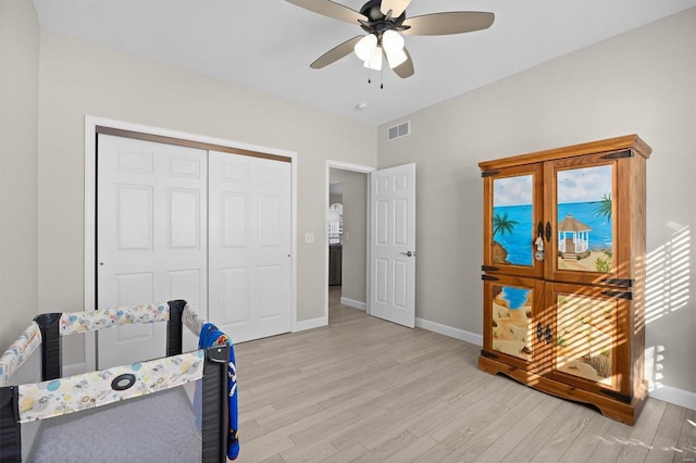 interior space featuring a closet, ceiling fan, and light hardwood / wood-style flooring