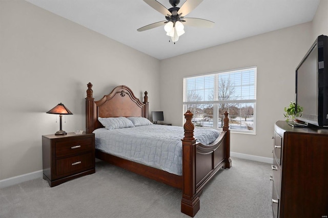 bedroom featuring light colored carpet and ceiling fan