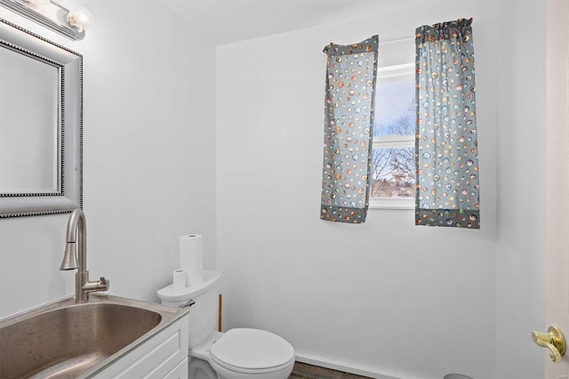 bathroom with vanity and toilet