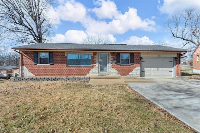 ranch-style home with a garage and a front lawn