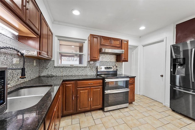 kitchen featuring ornamental molding, appliances with stainless steel finishes, decorative backsplash, and dark stone countertops