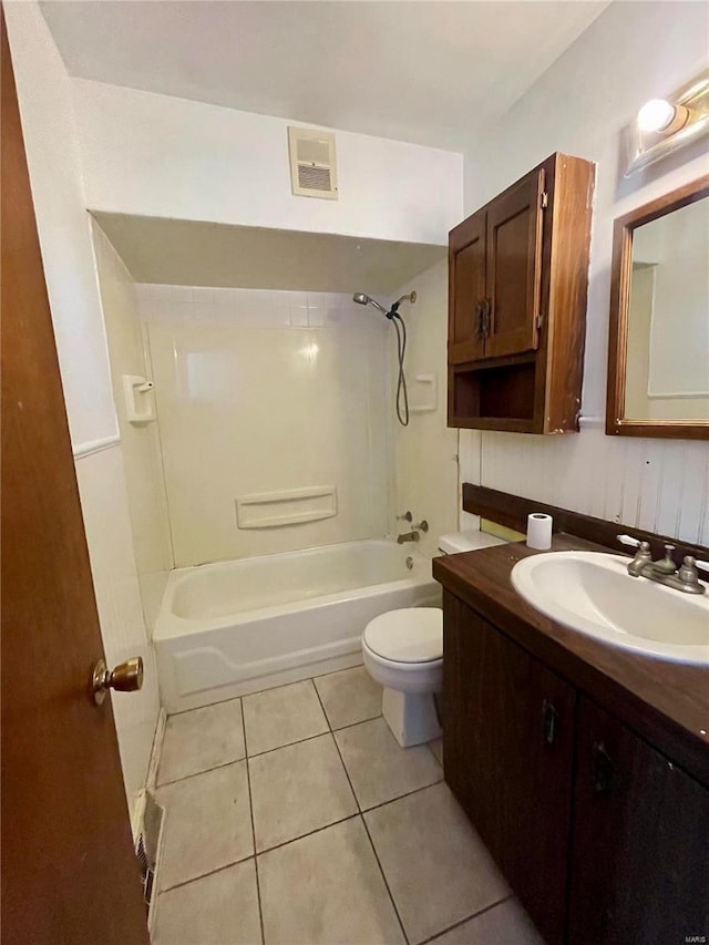 bathroom with visible vents, toilet, washtub / shower combination, vanity, and tile patterned flooring