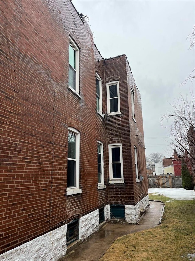 view of home's exterior with a yard