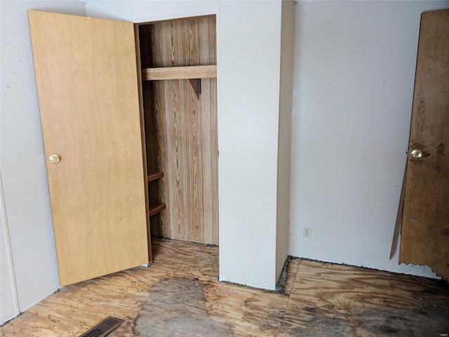 unfurnished bedroom with a closet