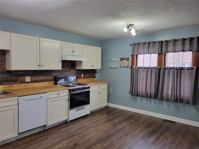 kitchen featuring butcher block countertops, backsplash, dark hardwood / wood-style flooring, white cabinets, and white appliances