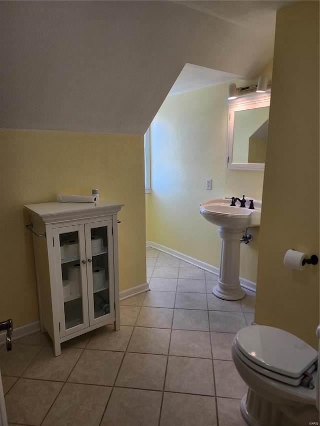 bathroom featuring tile patterned floors and toilet