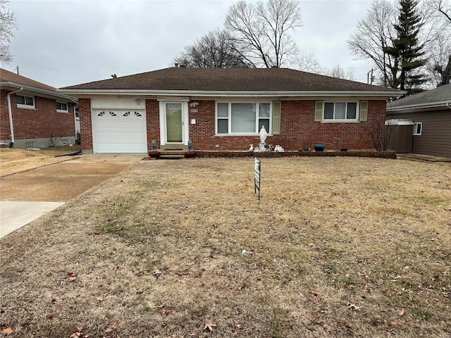 ranch-style home with a garage and a front lawn