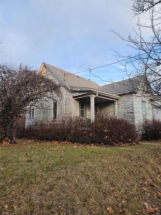 view of home's exterior with a lawn