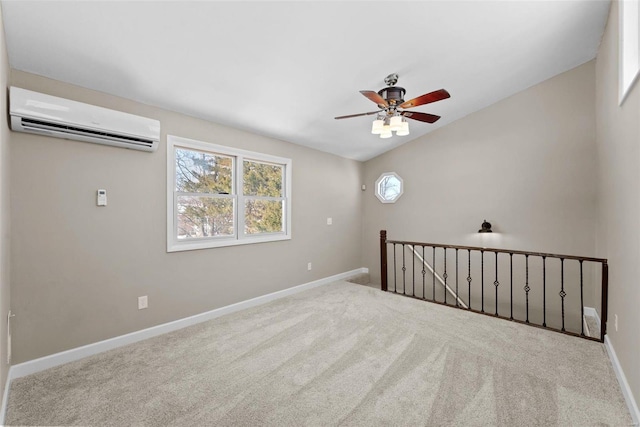 unfurnished room with lofted ceiling, a ceiling fan, an AC wall unit, light carpet, and baseboards