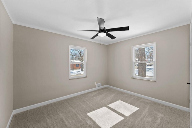 empty room with light carpet, baseboards, and a healthy amount of sunlight