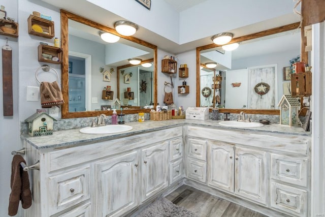 bathroom featuring hardwood / wood-style flooring and vanity