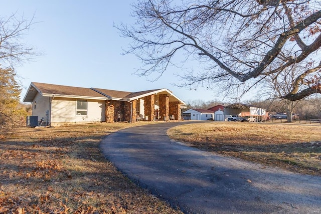 ranch-style home featuring cooling unit