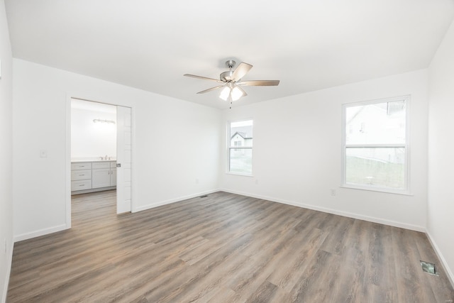 spare room with ceiling fan and light hardwood / wood-style flooring