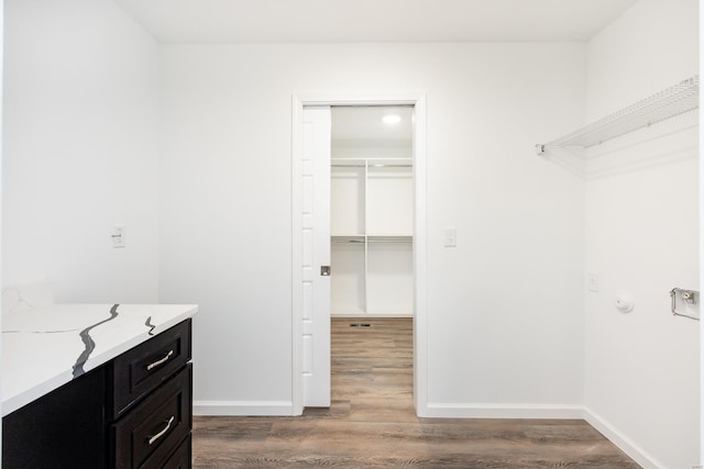 interior space with vanity and hardwood / wood-style floors