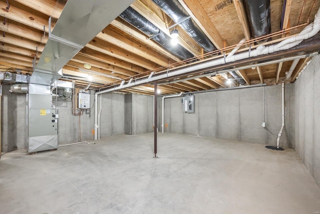 basement with water heater, electric panel, and heating unit