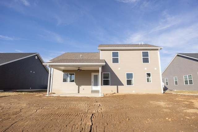 rear view of property featuring a patio area and ceiling fan