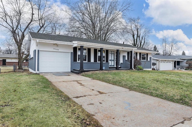 ranch-style house with a garage, covered porch, and a front lawn