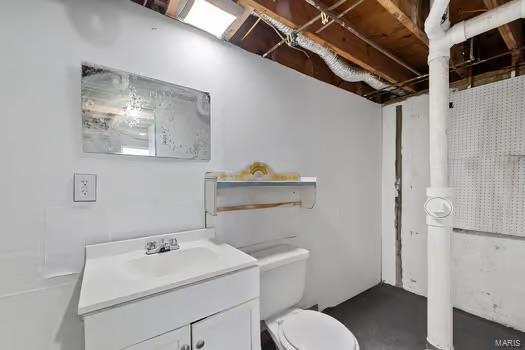 bathroom with toilet and vanity