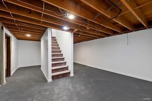 unfinished basement with stairway