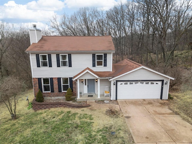 view of front of home featuring a garage, covered porch, and a front lawn