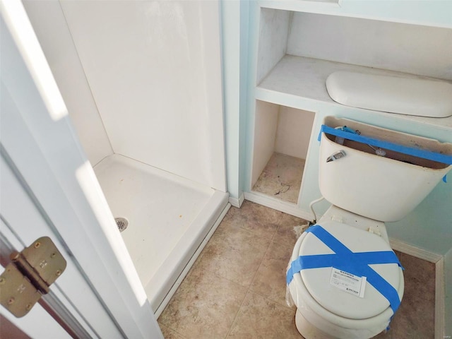 bathroom with tile patterned floors and toilet