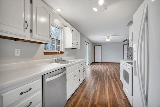 kitchen with sink, white cabinetry, ceiling fan, dark hardwood / wood-style flooring, and white appliances