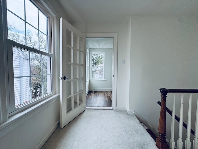 interior space with light colored carpet and french doors